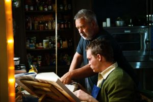 Luc Besson and Caleb Landry Jones behind the scenes on DogMan. Photo: Shana Besson.