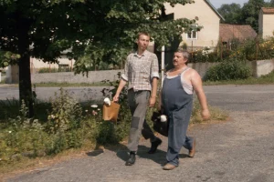 János Bán and Marián Labuda in My Sweet Little Village (1986)